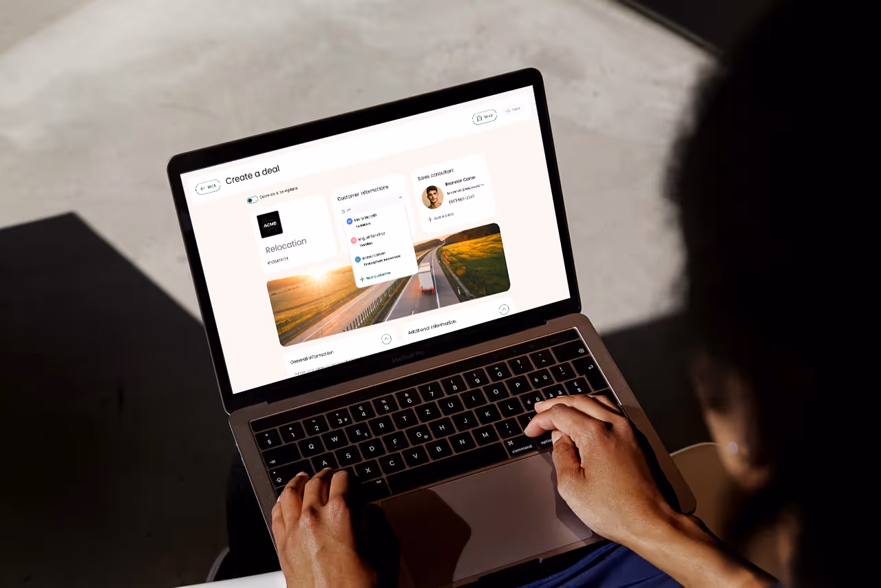Someone working on a laptop with a Duodeal proposal open on screen